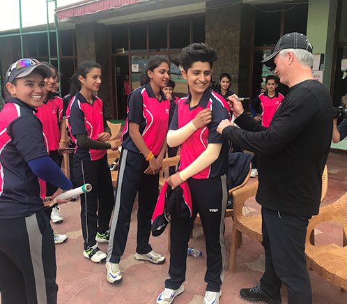 Steve Waugh signing the shirt of a local cricket team in India